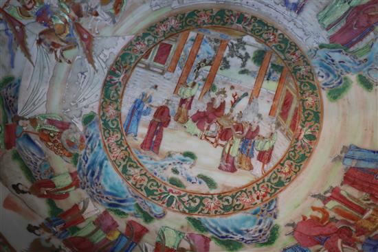 A large Chinese Canton-decorated famille rose punch bowl, c.1830, W.41.5cm, section broken and restuck, and two hairline cracks